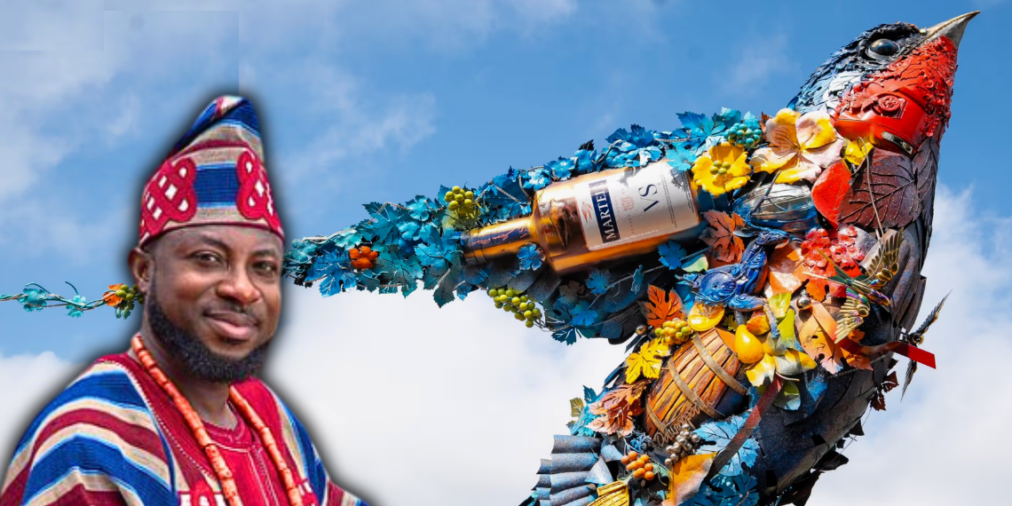Artist Dotun Popoola with his recycled metal Swift Ascendant sculpture created for Martells Abuja in