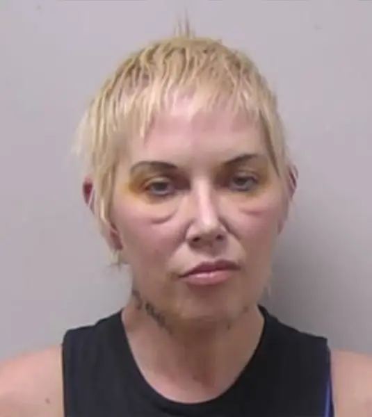 Eminems ex wife looks a shadow of herself in mug shot.webp